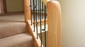 A wooden staircase with black metal railings. - A beautiful barn conversion set within the grounds of a working farm. (Benmore near Dunoon)