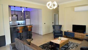 Premium Villa | Living area | 40-inch flat-screen TV with satellite channels, TV, Netflix