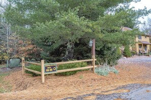 A wooden gate with a sign indicating buildings 491-499 and units 88-99. - Deerfield Village 99 (Davis)