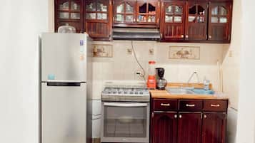 Basic House, 2 Bedrooms | Private kitchen | Fridge, microwave, stovetop, electric kettle