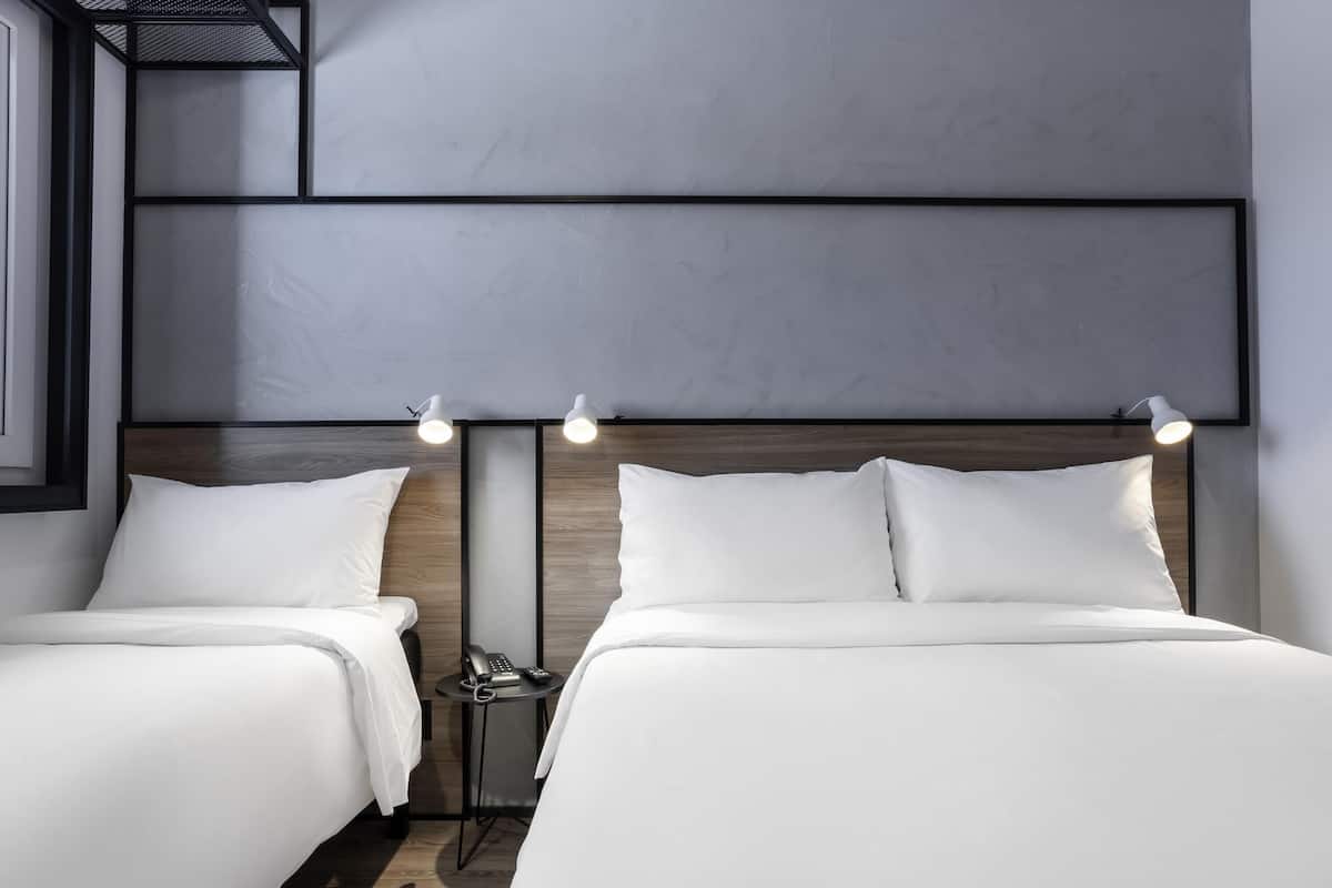 Standard Room, Multiple Beds | Minibar, blackout curtains, soundproofing, free WiFi