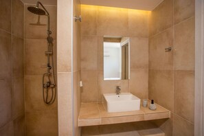 Shower, hair dryer, towels, toilet paper