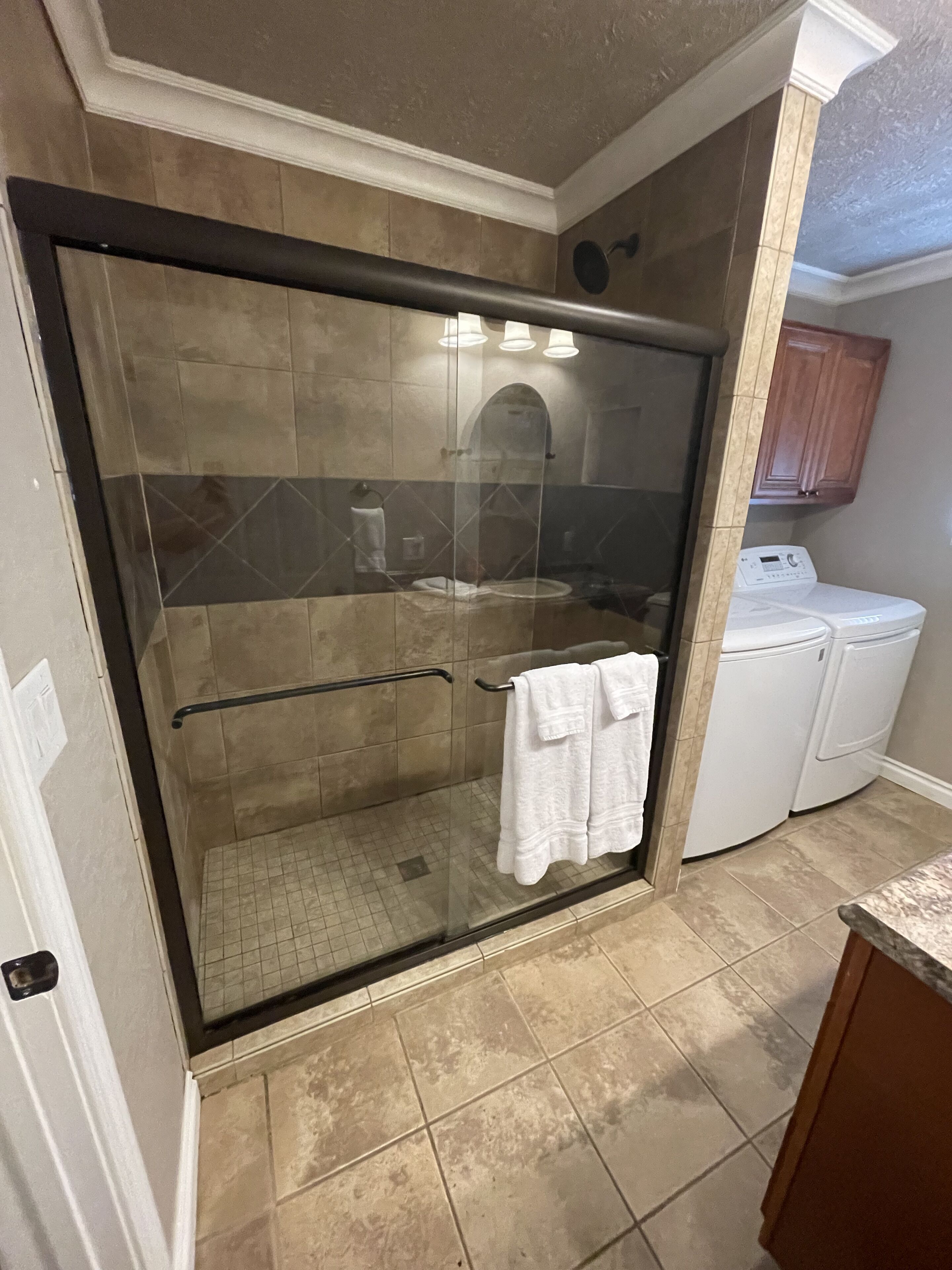 Shower, hair dryer, towels, toilet paper