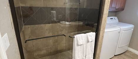 Shower, hair dryer, towels, toilet paper