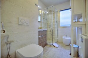 Shower, free toiletries, hair dryer, slippers