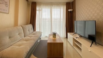 Apartment, 2 Bedrooms | Living area | TV