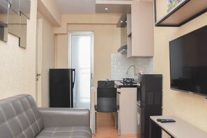 Apartamento, 1 quarto | Área de estar | TV