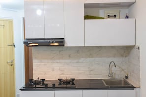 Apartment | Private kitchen - Comfort And Homey Studio At Amethyst Apartment (Jakarta)