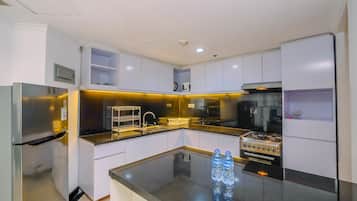 Apartment, 2 Bedrooms | Private kitchen | Fridge, stovetop, electric kettle, cookware/dishes/utensils