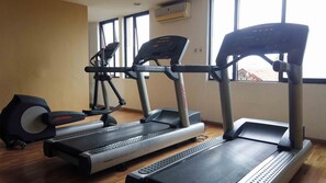 Work out in style with our fitness room featuring treadmills, elliptical trainers, and ample natural light.