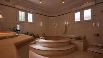 Shower, jetted bath, bidet, towels