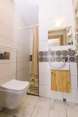 Comfort Room | Bathroom | Hair dryer, towels, soap, shampoo