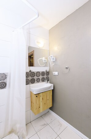 Comfort Room | Bathroom | Hair dryer, towels, soap, shampoo - Fully Equipped Room at taksim (Istanbul)