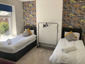 4 bedrooms, iron/ironing board, travel cot, WiFi