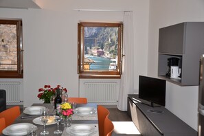 Luxury Apartment | Living area | 21-inch flat-screen TV with digital channels