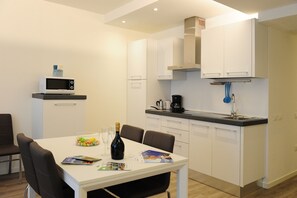 Luxury Apartment | Private kitchen | Full-size fridge, microwave, oven, stovetop