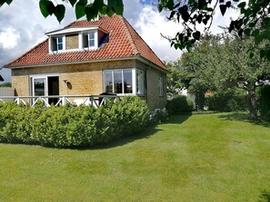 A two-story house with a red-tiled roof, brick walls, and large windows. - Private room in a charming bed-and-breakfast, 10 minutes from Copenhagen (Gentofte)
