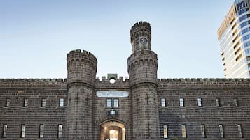 Explore the historic Penetridge Penitentiary, a 19th-century fortified structure with a clock tower and central entrance.