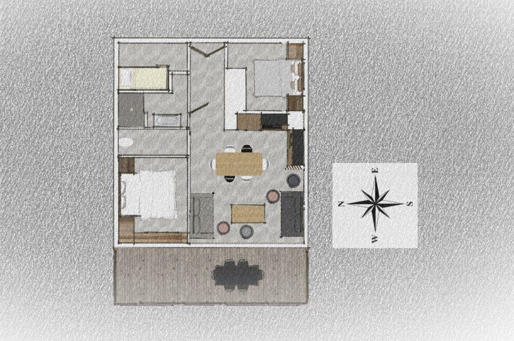 Un plan d’étage d’une chambre d’hôtel comprenant un lit, un bureau, une chaise, une petite table et un canapé.