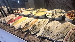 A buffet with various dishes and utensils. - Tal Beach Hotel (Kemer)