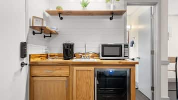 Mini-fridge, microwave, coffee/tea maker, cookware/dishes/utensils
