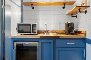 Microwave, coffee/tea maker, cookware/dishes/utensils, paper towels
