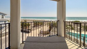 A balcony with a view of the beach and ocean. - Oceanfront Balcony Views, Pool,  STEPS to Beach, Restaurants, Shops (Wrightsville Beach)