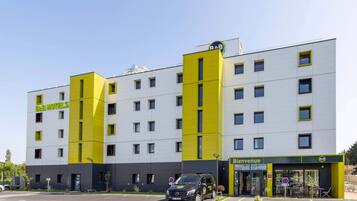 Welcome to BBH Hotels, where a modern entrance and available parking await.