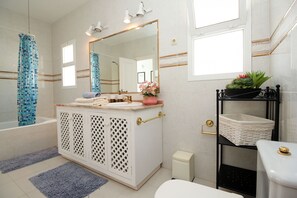 Bathtub, hair dryer, towels