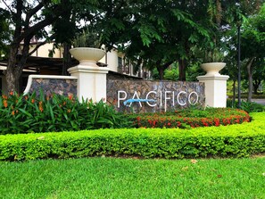 Experience the serene atmosphere of Pacifico, surrounded by lush gardens and vibrant flowers.