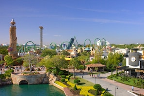 A theme park with various rides, a prominent tower, and a water feature. - 4013 201 Vista Cay (Orlando)