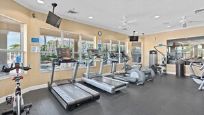 A gym with treadmills, elliptical machines, and weight equipment. - 7755 Windsor Hills (Kissimmee)