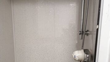 Shower, rainfall showerhead, towels, soap