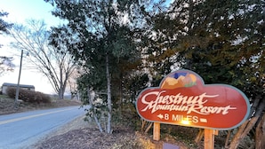 A sign for Chestnut Mountain Resort with a distance marker of 8 miles. - The (Veteran Owned) Hanover Hangout Guesthouse - cozy cottage w/ privacy + fun (Hanover)