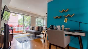 Premium Apartment, Balcony, Ground Floor (102) | Living area | 50-inch flat-screen TV with cable channels, offices