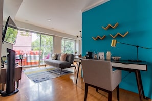 Premium Apartment, Balcony, Ground Floor (102) | Living area | 50-inch flat-screen TV with cable channels, offices