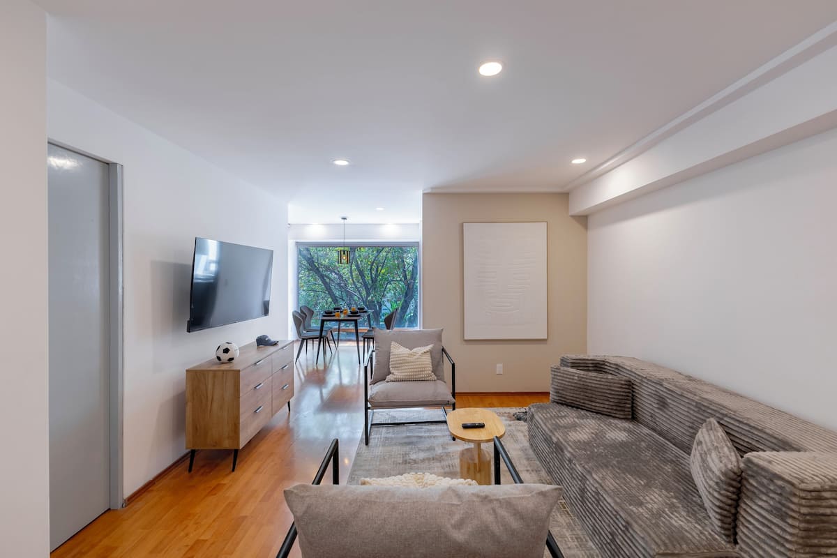 Deluxe Apartment, Balcony (301) | Living area | 50-inch flat-screen TV with cable channels, offices