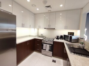 Luxury Apartment | Private kitchen | Fridge, microwave, oven, stovetop