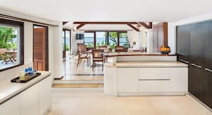 Enjoy meals in the kitchen with a central island and dining area through the adjacent doorway.