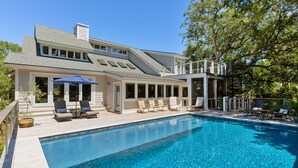 A two-story house with a swimming pool, outdoor seating, and a covered patio area. - Private Pool, Elevator, 4-Seater Golf Cart (fee), Golf Course view- 8 Hidden Green (Isle Of Palms)