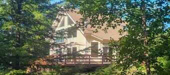 Sunny coastal retreat with deck, grill, beach, dock, & ocean access