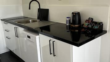 Full-sized fridge, microwave, stovetop, dishwasher
