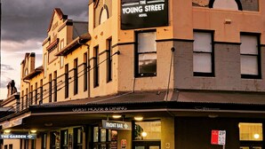 The Young Street Hotel with a sign indicating it's a guest house and dining establishment. - The Young Street Hotel (Carrington)