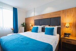 Ropa de cama de alta calidad y minibar 