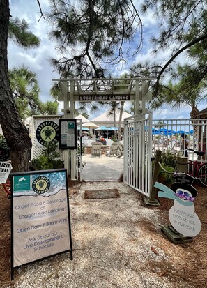 A beachside entrance with a sign for Loggerhead Landing, a turtle logo, and a sign for ordering food and beverages. - Available August 2-10! 6 min walk to the beach!  (Hilton Head Island)