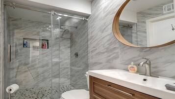 Shower, hair dryer, towels, soap