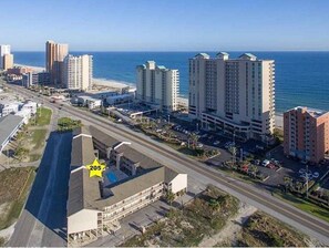 Overlooking the ocean, this beachfront property offers stunning views of the coastline.