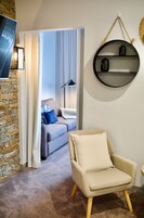 Luxury Suite, 2 Bedrooms (Family Suite 8) | Living area | 55-inch Smart TV with digital channels, TV