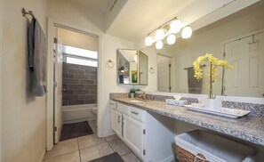 Combined shower/tub, towels, soap, toilet paper