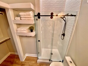 Shower, towels, soap, toilet paper